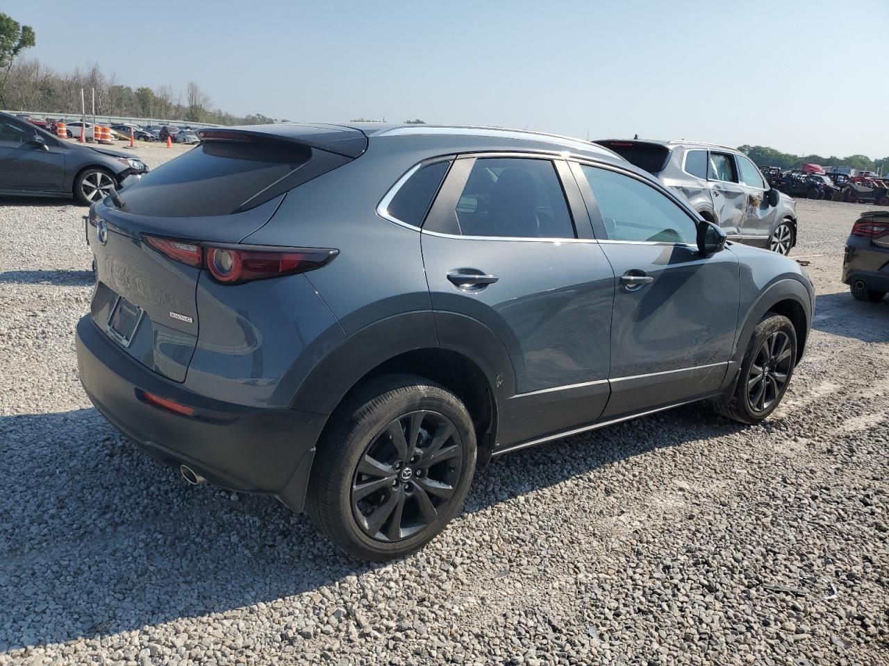 2023 Mazda CX-30 VIN 3MVDMBCM0PM515814 Copart auction photo, hail damage thumbnail 3