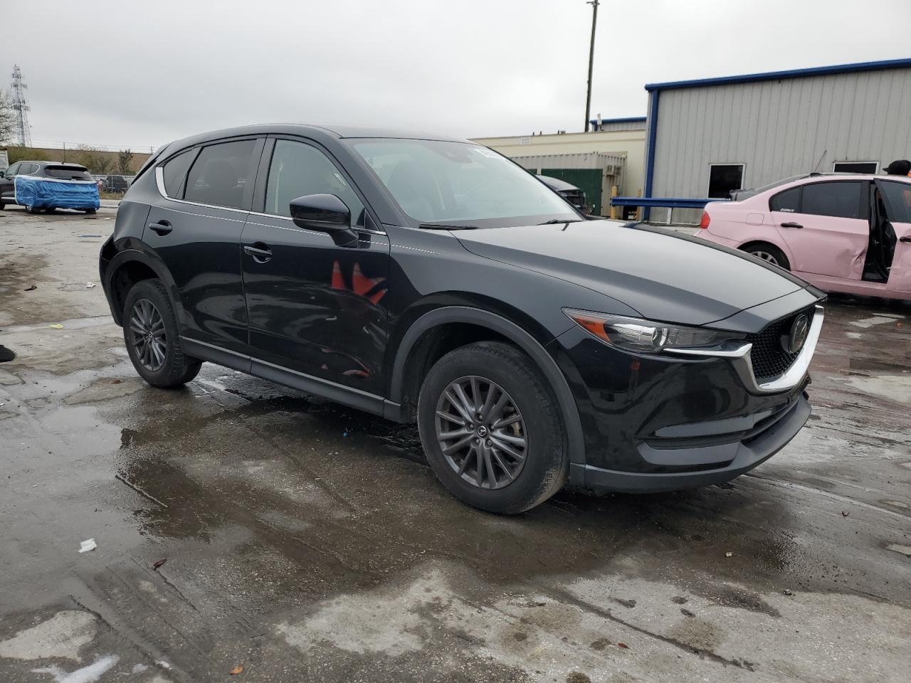 2021 Mazda CX-5 VIN JM3KFBCMXM0489652 Copart auction photo, rear end damage thumbnail 4