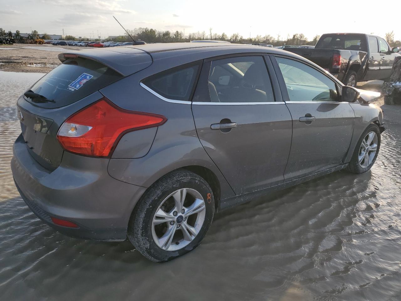 2012 Ford Focus VIN 1FAHP3M26CL221638 Copart auction photo, front end / minor dent/scratches damage thumbnail 3