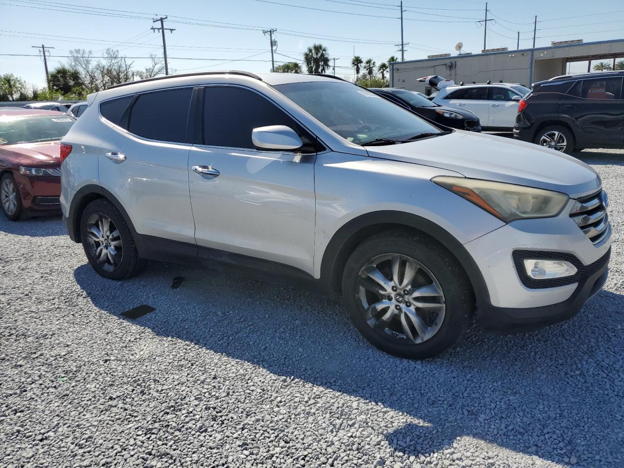 2013 Hyundai Santa Fe VIN 5XYZU3LA1DG064842 Copart auction photo, water/flood damage thumbnail 4