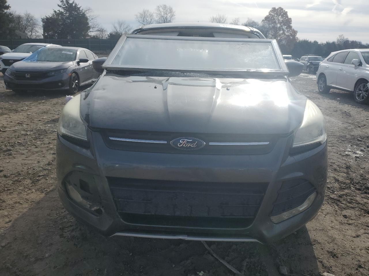 2015 Ford Escape VIN 1FMCU0G72FUA56829 Copart auction photo, all over damage thumbnail 5