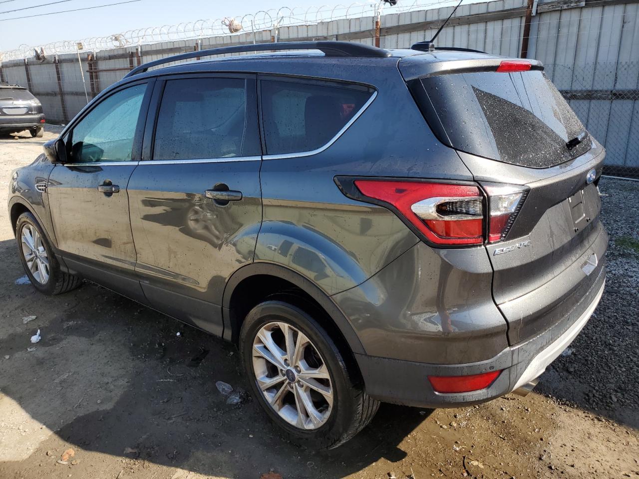 2017 Ford Escape VIN 1FMCU0GD5HUD54011 Copart auction photo, side damage thumbnail 2