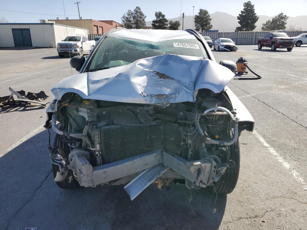 2010 Jeep Compass VIN 1J4NT4FB7AD549325 Copart auction photo, front end / top/roof damage thumbnail 5