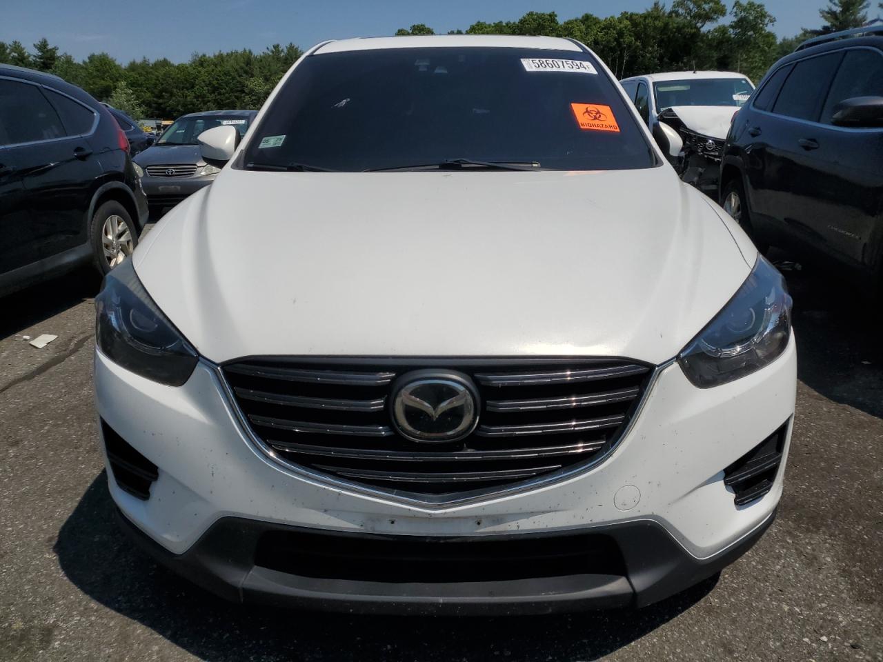 2016 Mazda CX-5 VIN JM3KE4DYXG0878943 Copart auction photo, undercarriage / side damage thumbnail 5