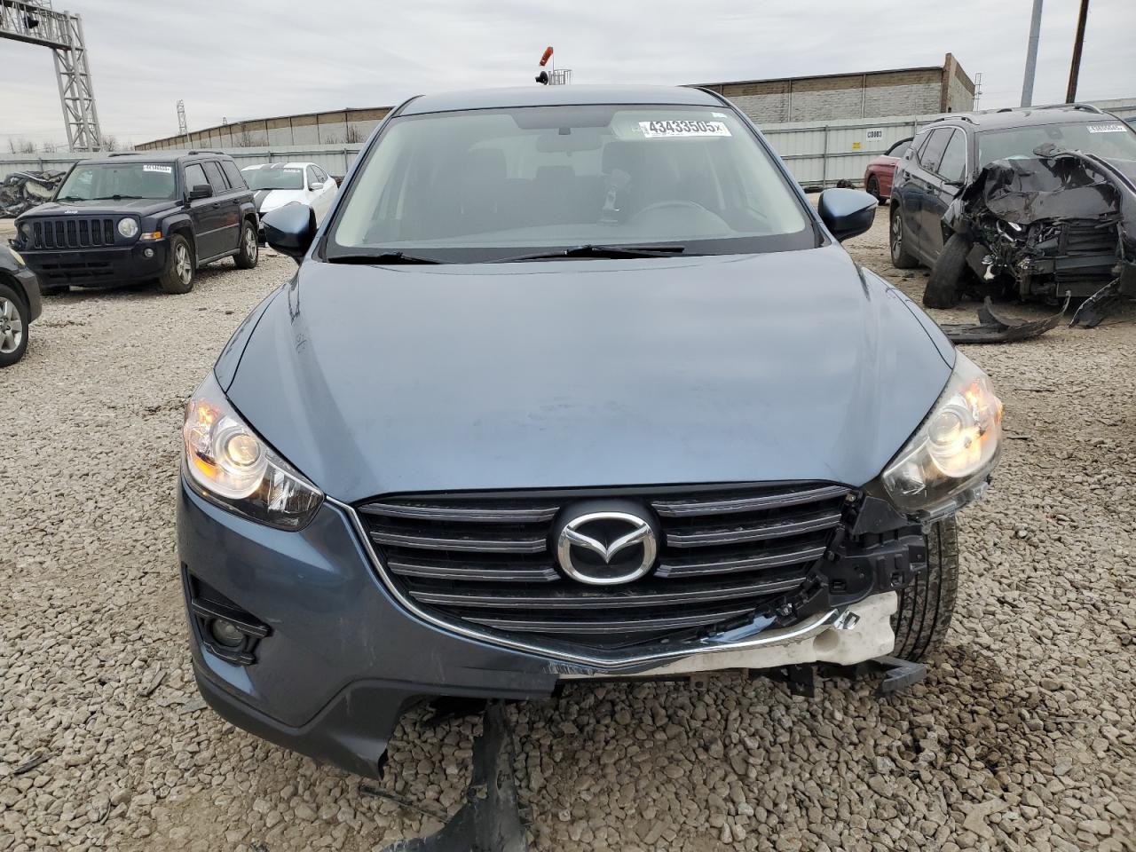 2016 Mazda CX-5 VIN JM3KE2CY7G0776117 Copart auction photo, front end damage thumbnail 5