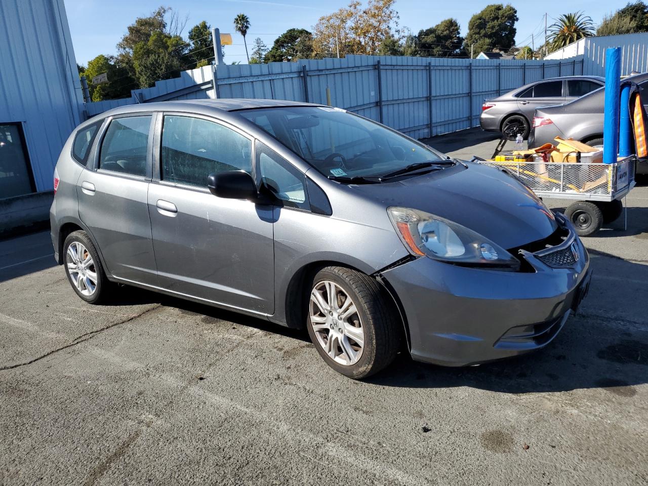 2011 Honda Fit VIN JHMGE8H34BS008279 Copart auction photo, side / all over damage thumbnail 4