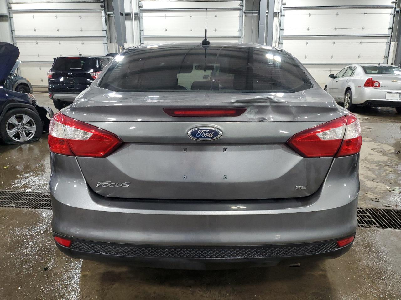 2012 Ford Focus VIN 1FAHP3F25CL237052 Copart auction photo, all over damage thumbnail 6