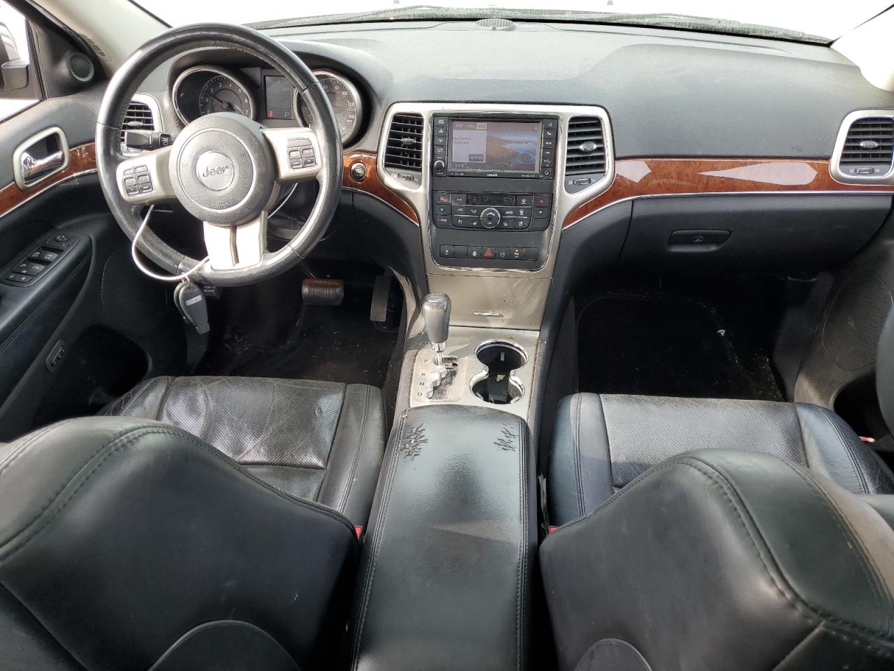 2012 Jeep Grand Cherokee VIN 1C4RJFBG4CC302668 Copart auction photo, front end / undercarriage damage thumbnail 8