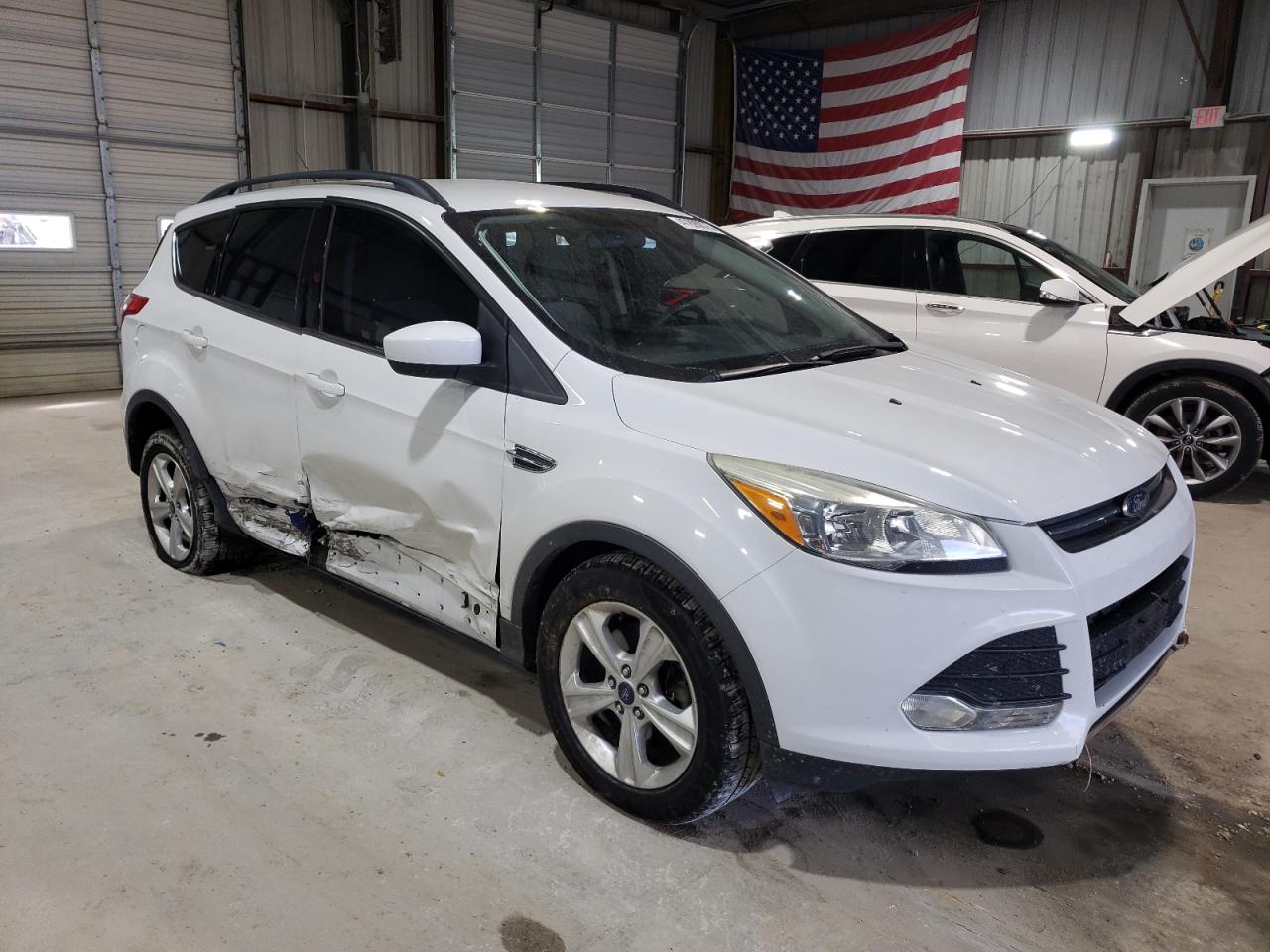 2015 Ford Escape VIN 1FMCU0G95FUC26702 Copart auction photo, side / minor dent/scratches damage thumbnail 4