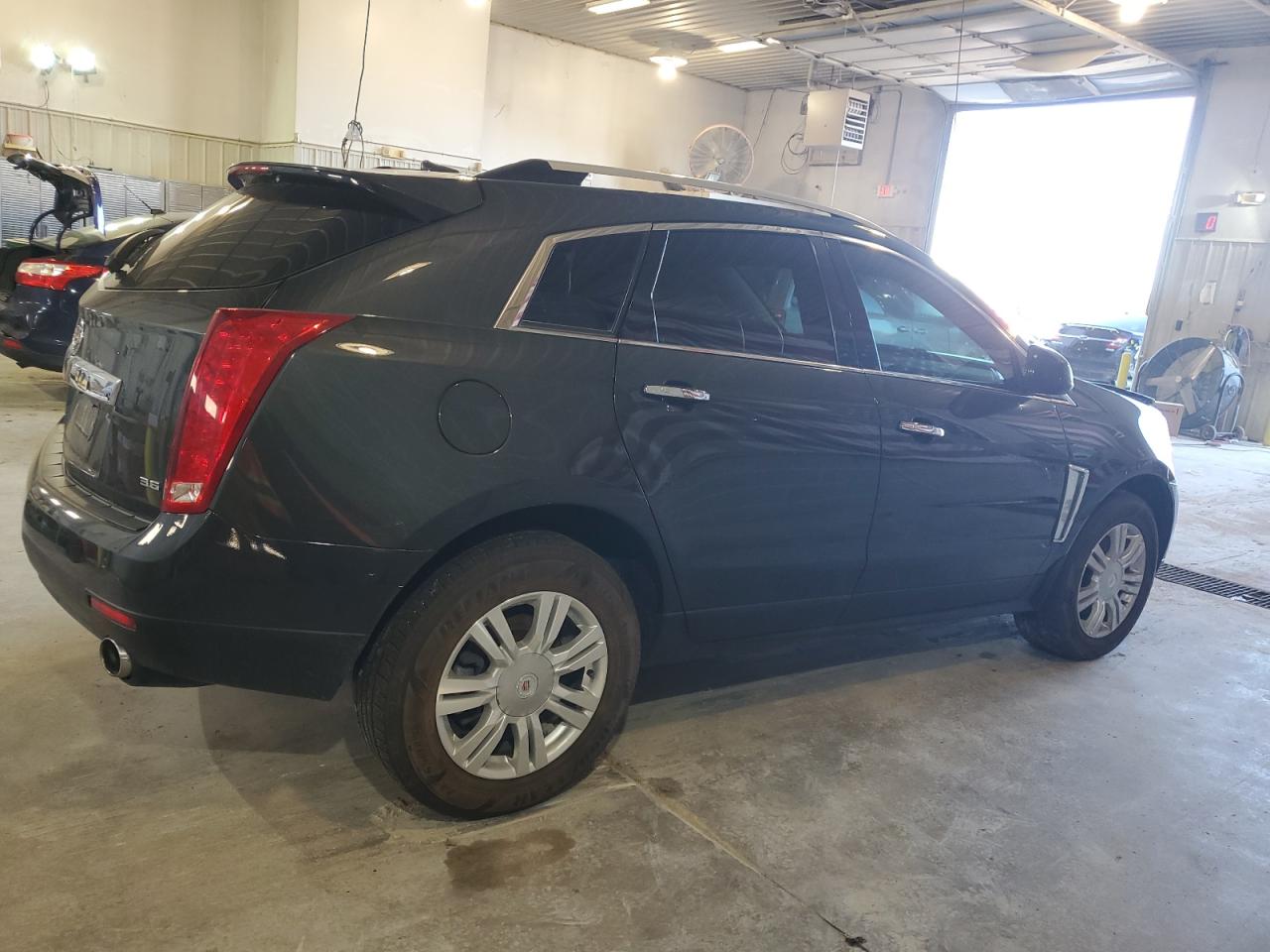 2014 Cadillac SRX VIN 3GYFNEE39ES611473 Copart auction photo, front end / side damage thumbnail 3
