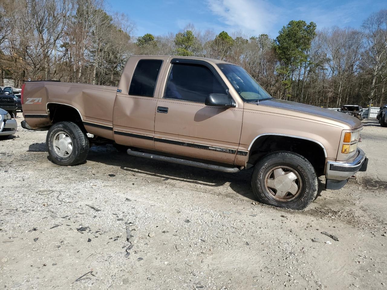 1995 GMC Sierra VIN 1GTEK19K6SE543949 Copart auction photo, rear end / all over damage thumbnail 4