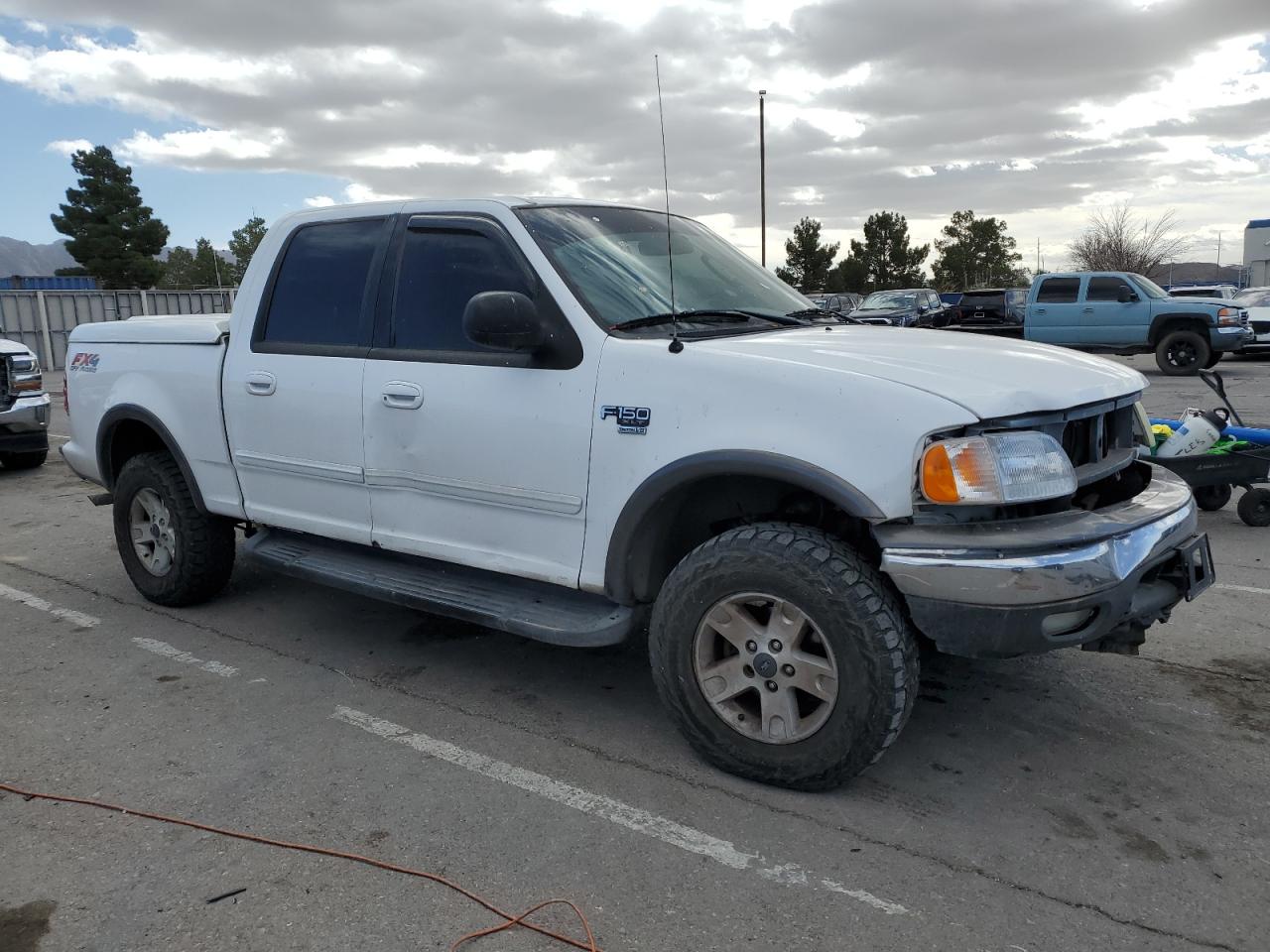 2002 Ford F-150 VIN 1FTRW08L32KE29970 Copart auction photo, all over damage thumbnail 4