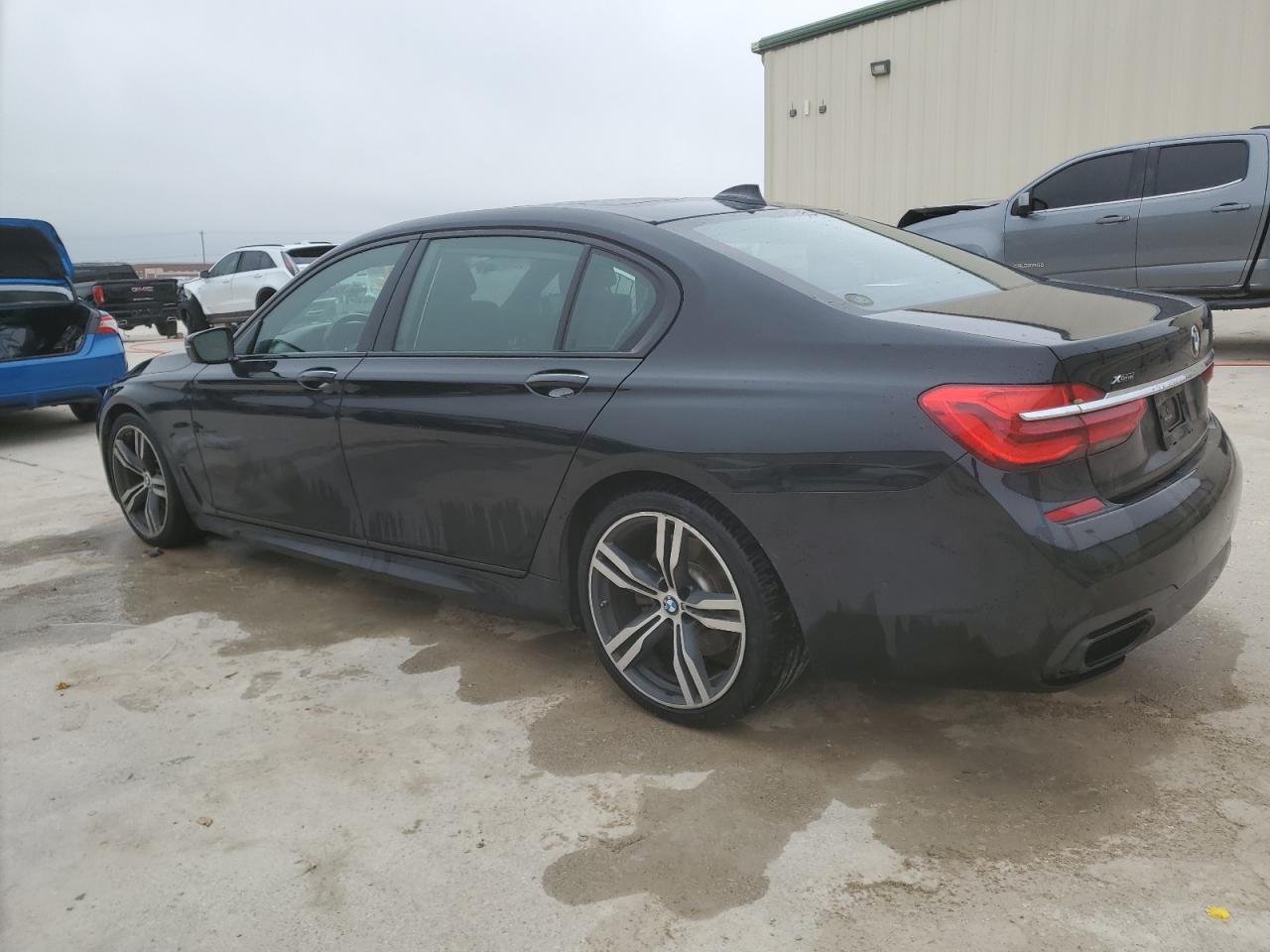 2018 BMW 7er VIN WBA7F2C5XJG423853 Copart auction photo, undercarriage / minor dent/scratches damage thumbnail 2