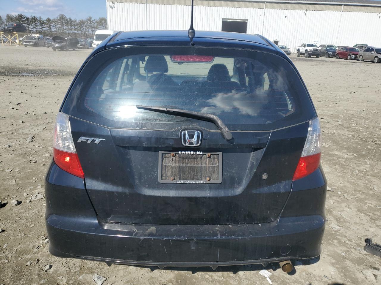 2010 Honda Fit VIN JHMGE8H23AC030712 Copart auction photo, all over damage thumbnail 6