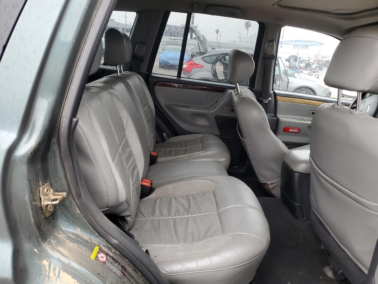 2002 Jeep Grand Cherokee VIN 1J8GW68JX2C279609 Copart auction photo, side damage thumbnail 11