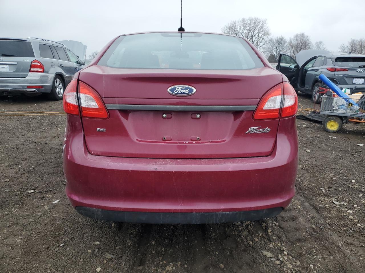 2011 Ford Fiesta VIN 3FADP4BJ7BM226147 Copart auction photo, all over damage thumbnail 6