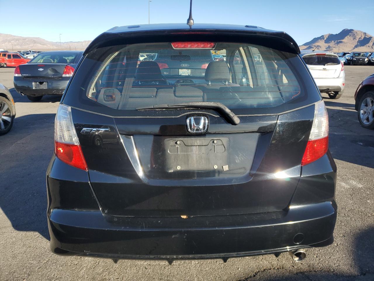 2012 Honda Fit VIN JHMGE8H55CC001421 Copart auction photo, minor dent/scratches damage thumbnail 6