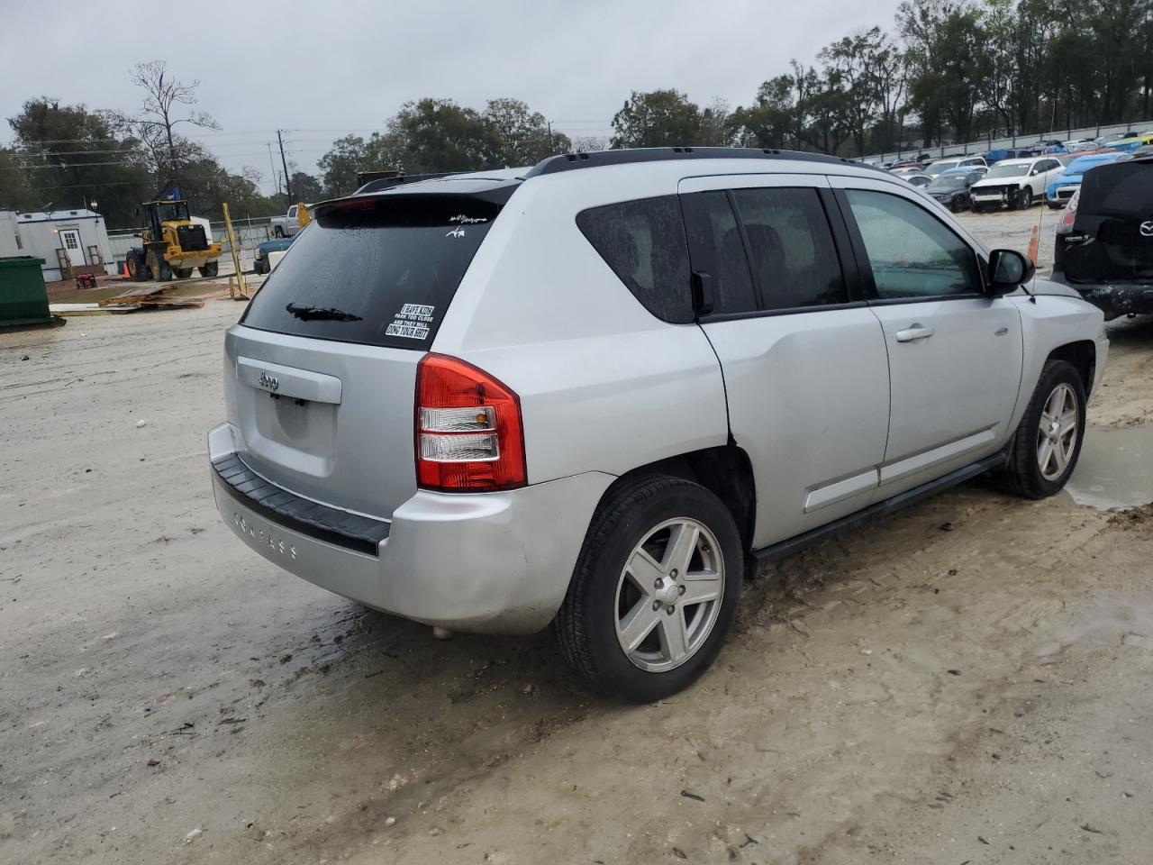 2010 Jeep Compass VIN 1J4NT1FA5AD676600 Copart auction photo, minor dent/scratches damage thumbnail 3