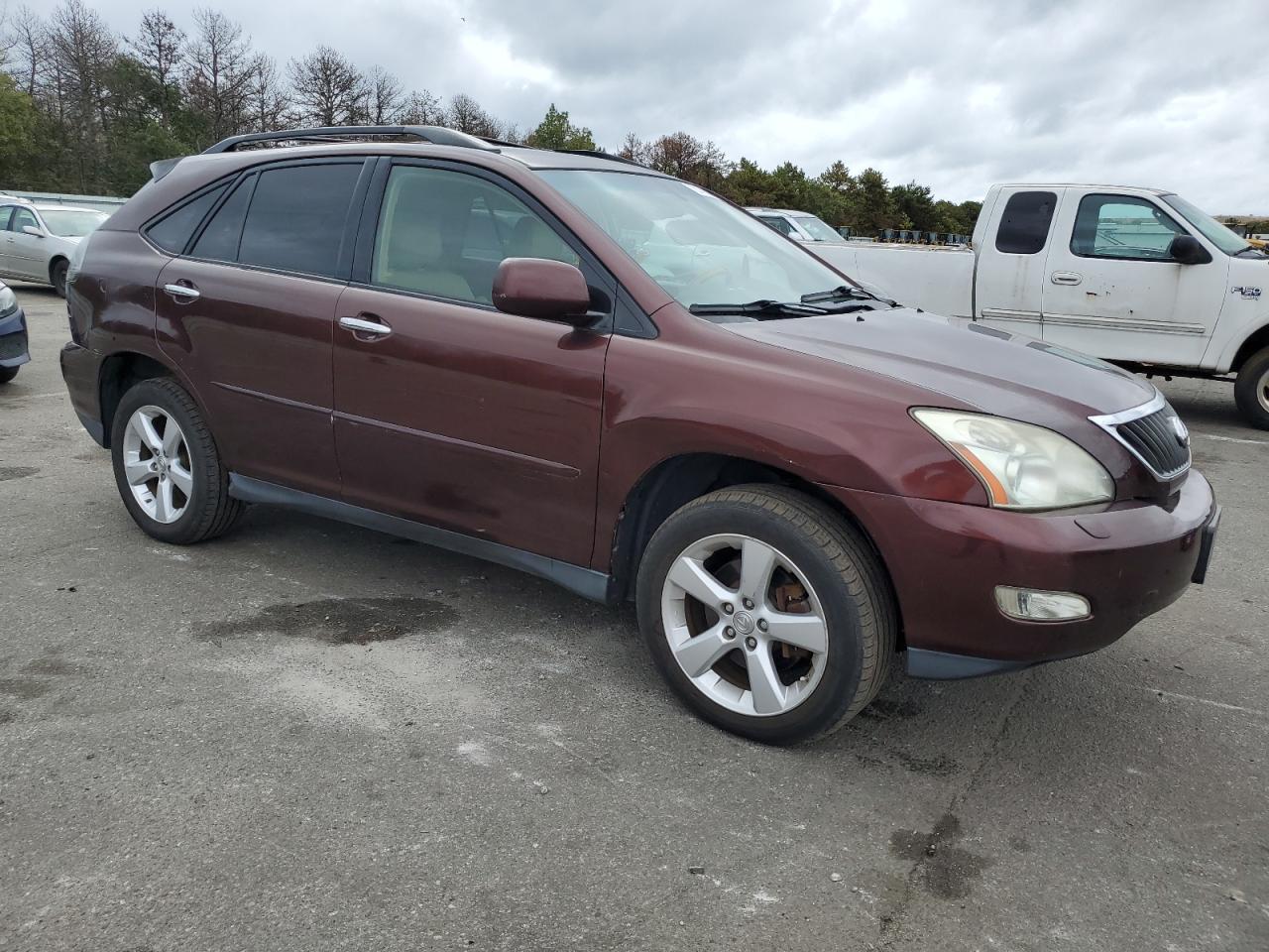 2009 Lexus RX VIN JTJGK31U999852204 Copart auction photo, rear end / minor dent/scratches damage thumbnail 4