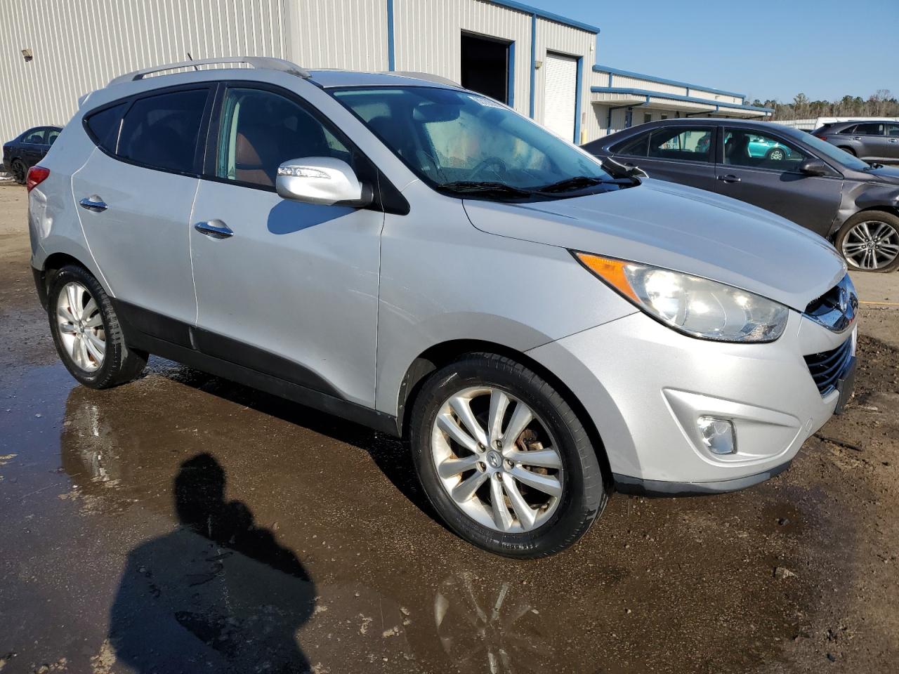 2011 Hyundai Tucson VIN KM8JUCAC6BU248926 Copart auction photo, front end / side damage thumbnail 4