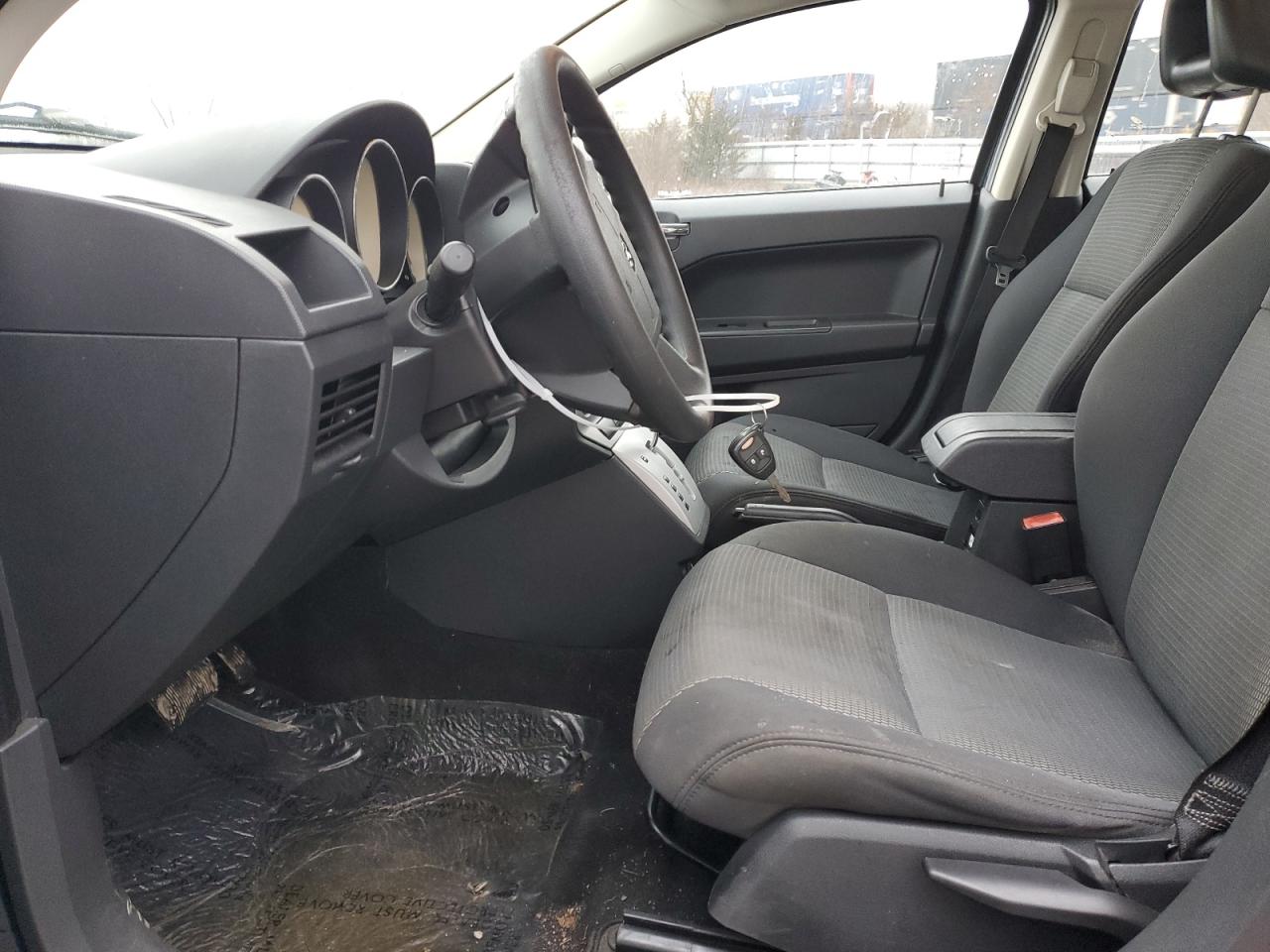 2009 Dodge Caliber VIN 1B3HB48A09D233532 Copart auction photo, rear end damage thumbnail 7