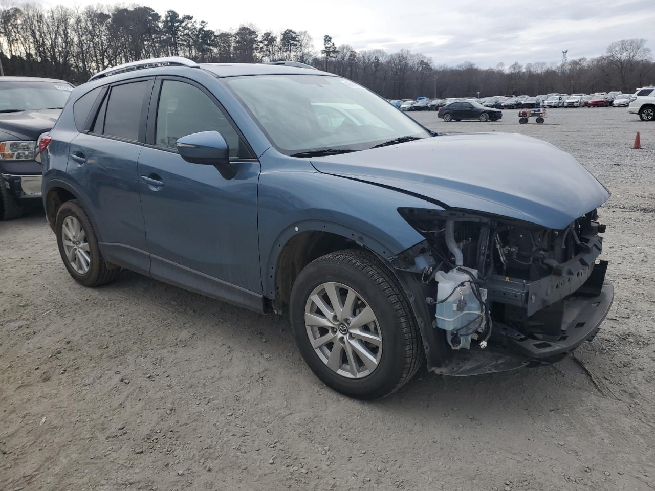 2016 Mazda CX-5 VIN JM3KE2CY1G0885690 Copart auction photo, front end / minor dent/scratches damage thumbnail 4