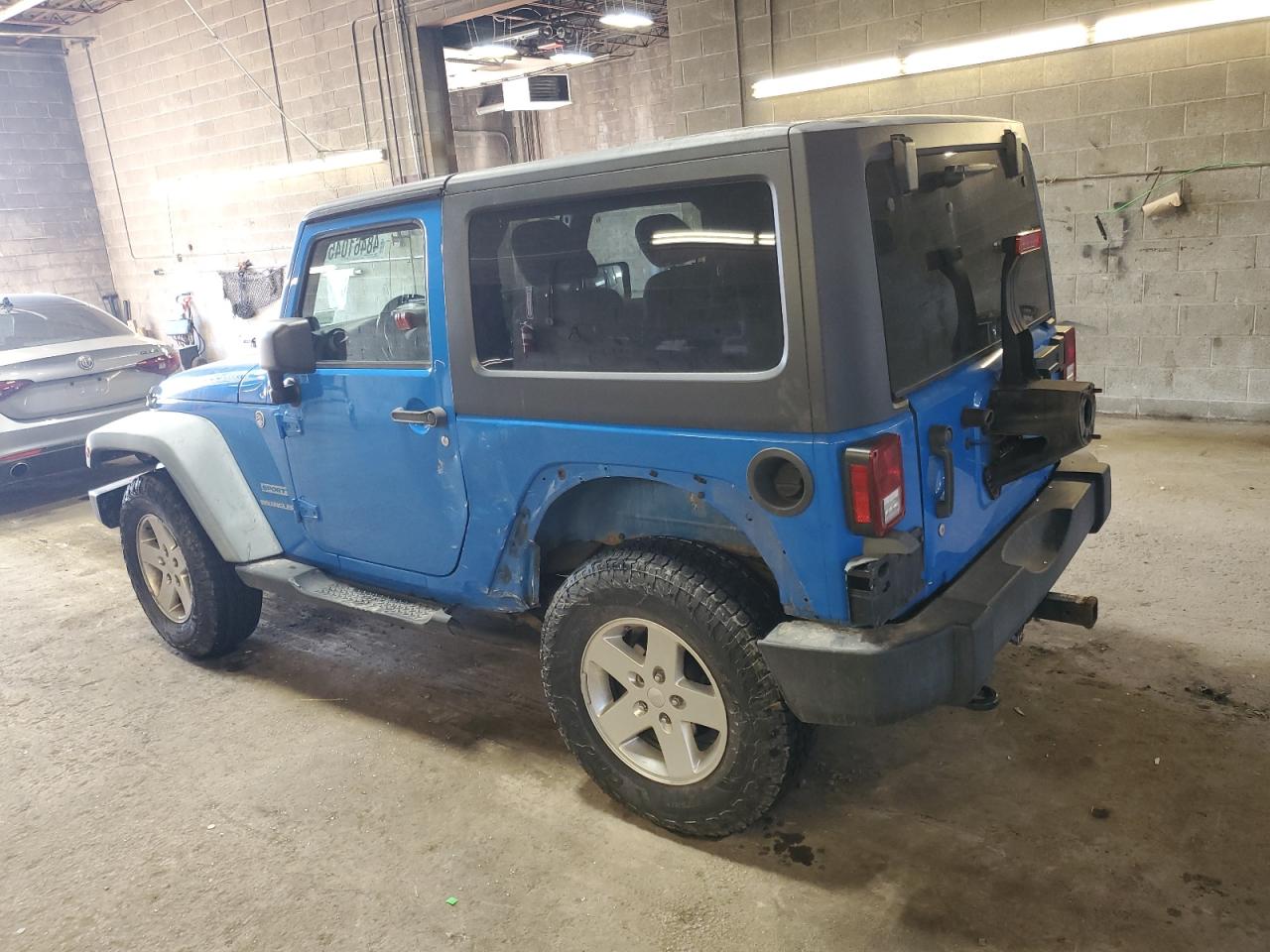 2011 Jeep Wrangler VIN 1J4AA2D1XBL552973 Copart auction photo, side / front end damage thumbnail 2