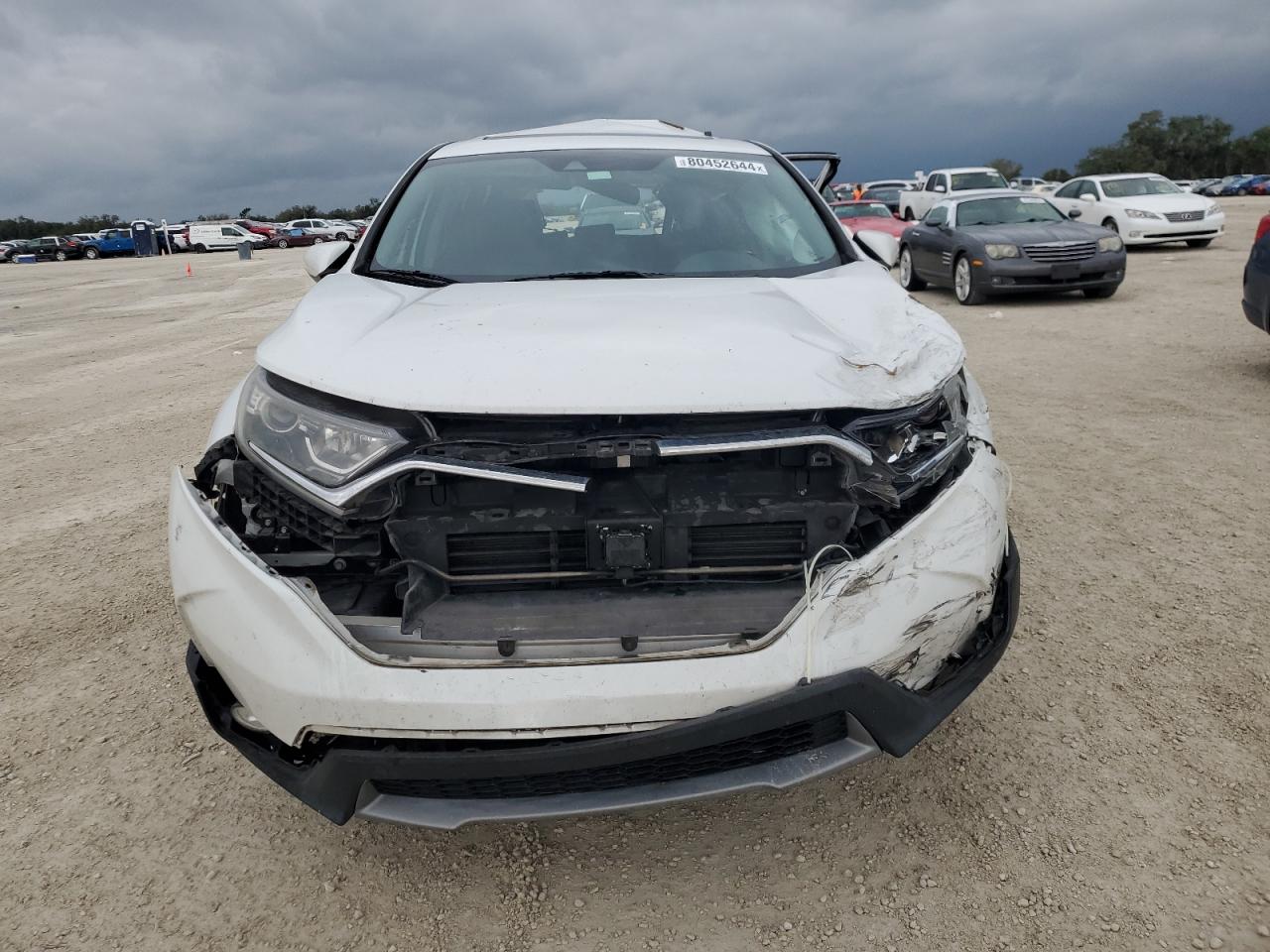 2019 Honda CR-V VIN 2HKRW1H57KH509021 Copart auction photo, all over damage thumbnail 5