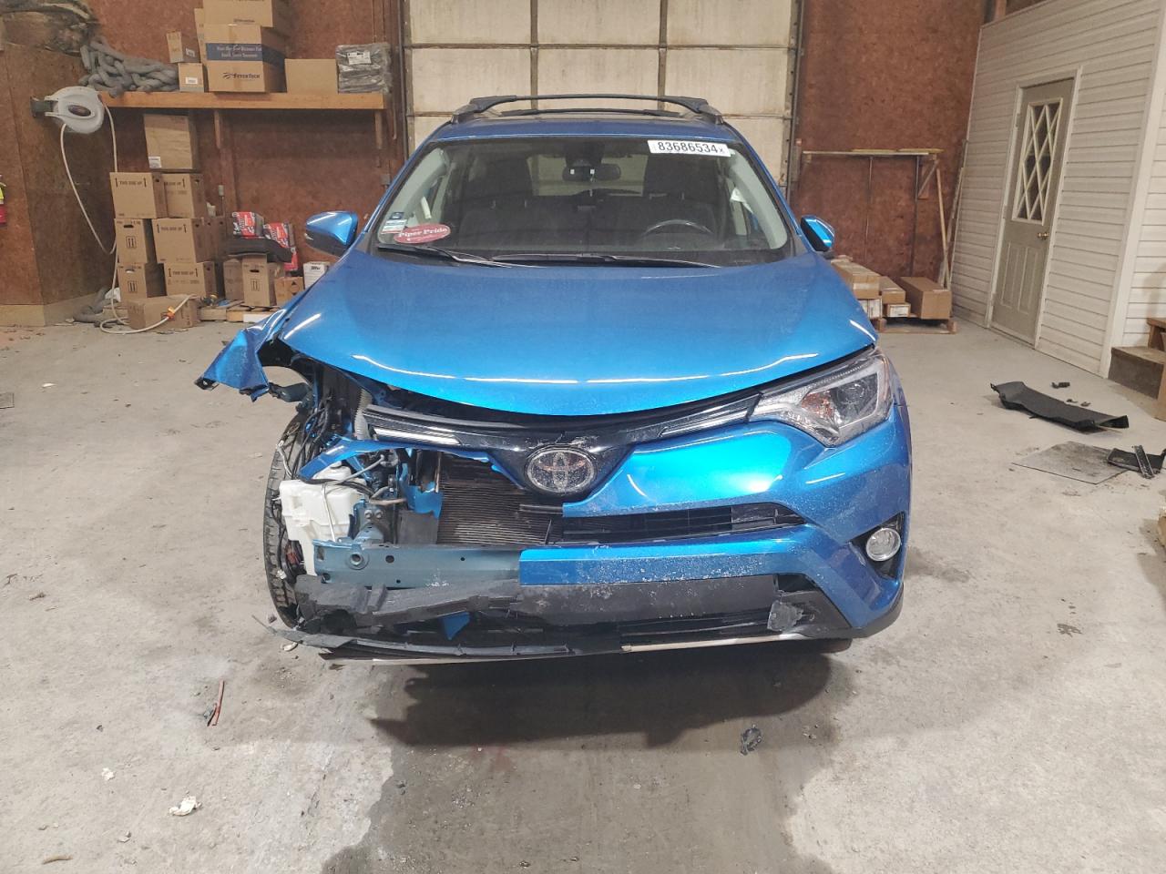 2018 Toyota RAV 4 VIN JTMRFREV3JJ734397 Copart auction photo, front end / side damage thumbnail 5
