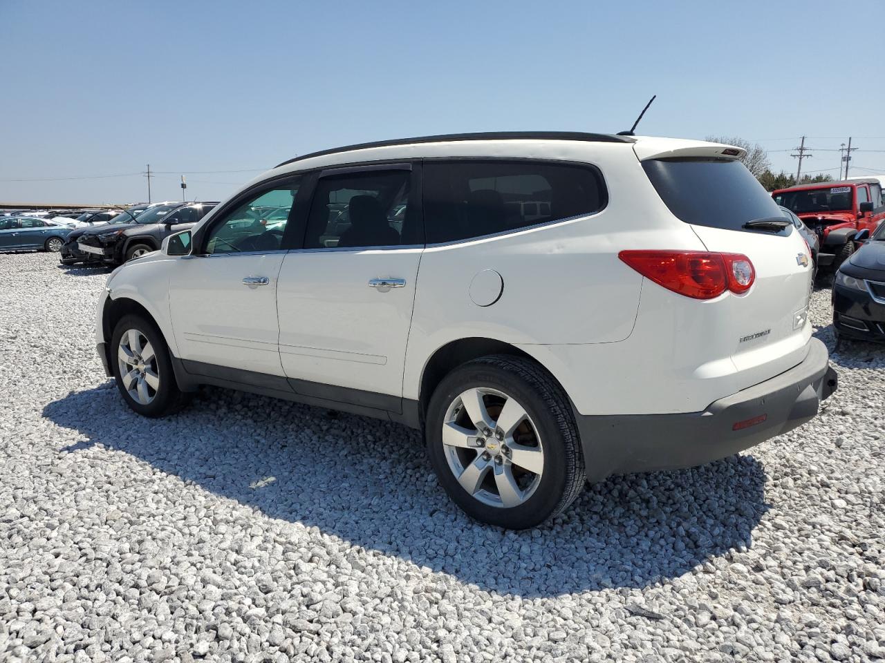 2012 Chevrolet Traverse VIN 1GNKVGED9CJ404080 Copart auction photo, front end / hail damage thumbnail 2