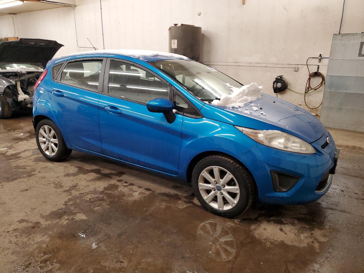 2012 Ford Fiesta VIN 3FADP4EJ7CM219003 Copart auction photo, rear end damage thumbnail 4