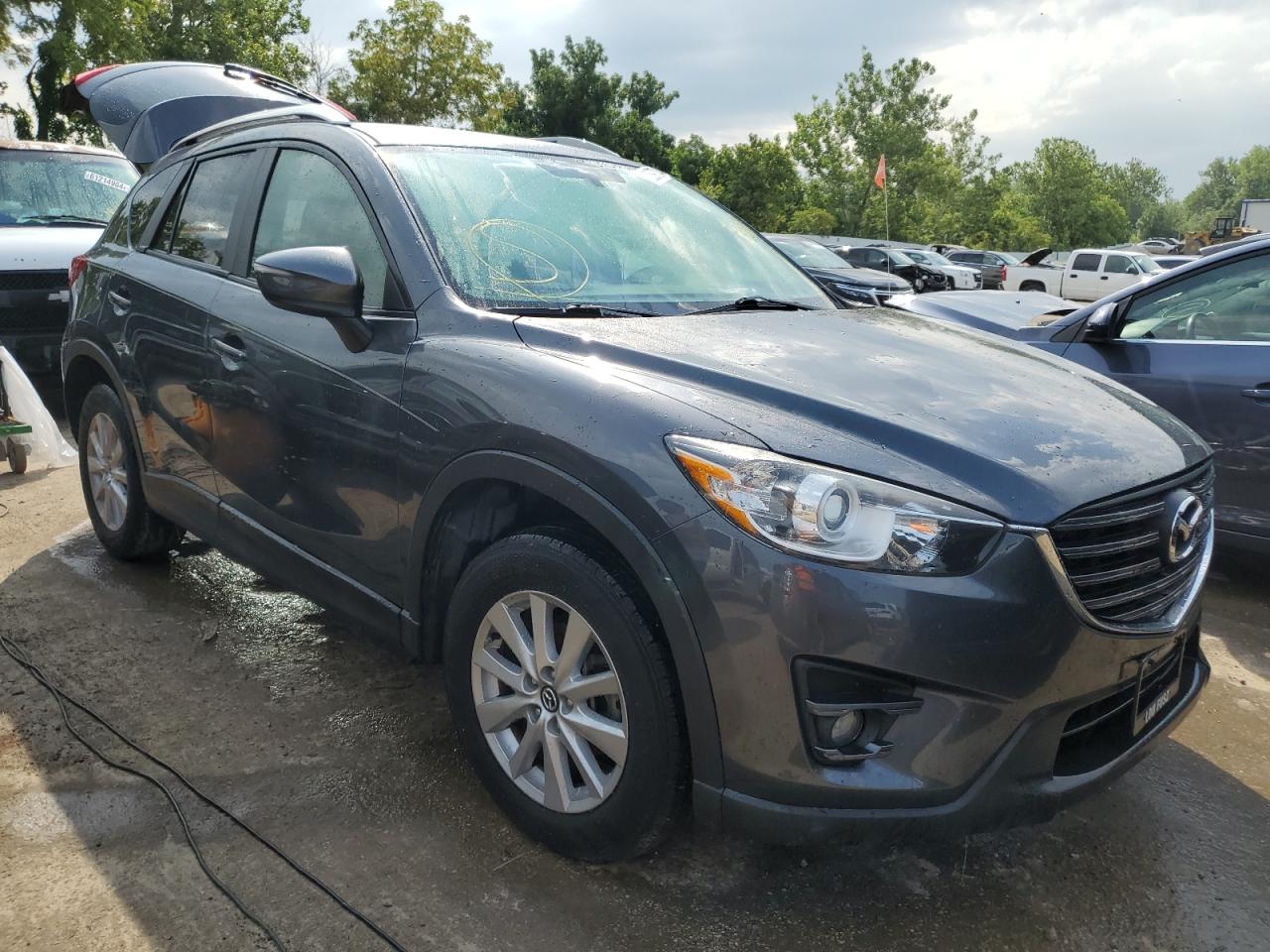 2016 Mazda CX-5 VIN JM3KE2CY7G0623916 Copart auction photo, water/flood damage thumbnail 4