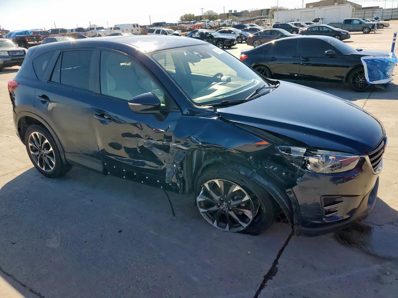 2016 Mazda CX-5 VIN JM3KE2DY6G0668313 Copart auction photo, side / front end damage thumbnail 4