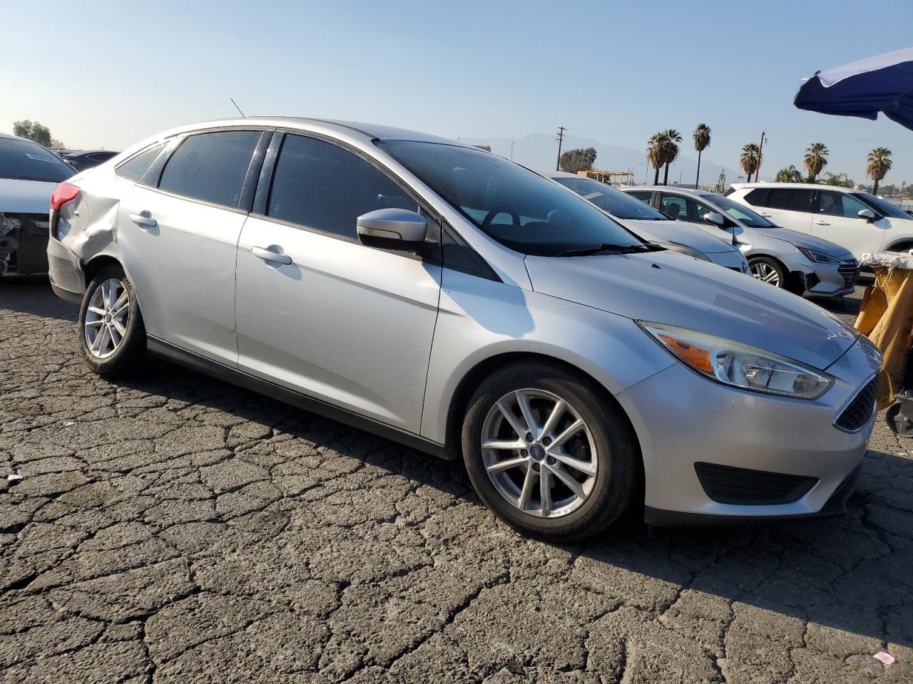 2016 Ford Focus VIN 1FADP3F20GL297597 Copart auction photo, rear end damage thumbnail 4