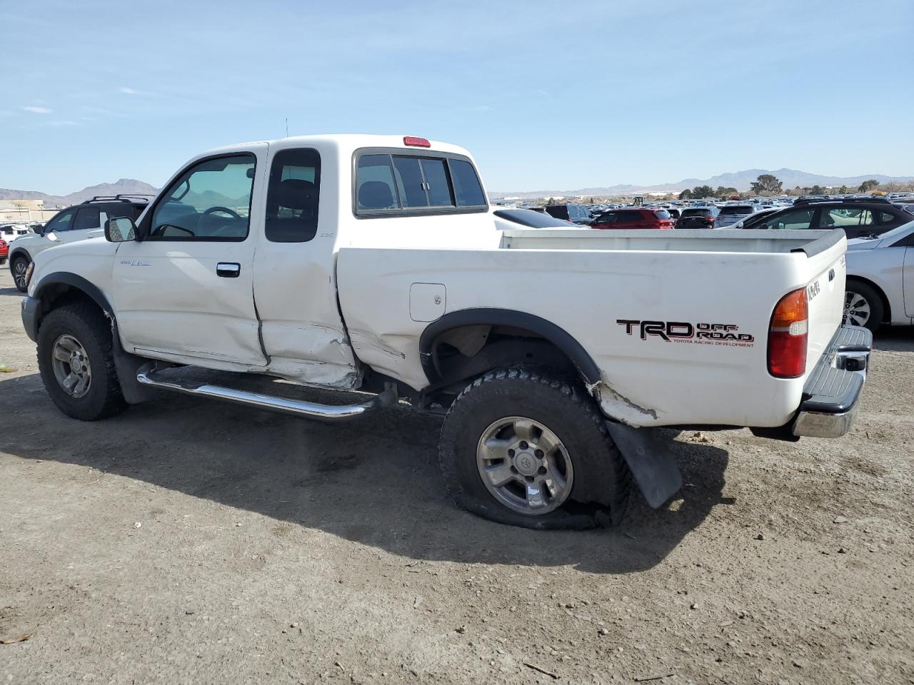 1999 Toyota Tacoma VIN 4TASN92N3XZ529595 Copart auction photo, side / rear end damage thumbnail 2