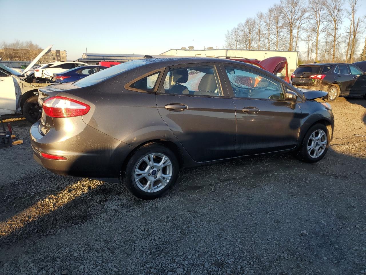 2015 Ford Fiesta VIN 3FADP4BJXFM214127 Copart auction photo, front end / side damage thumbnail 3