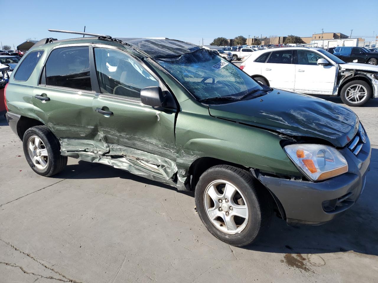 2005 KIA Sportage VIN KNDJF724857115374 Copart auction photo, rollover / all over damage thumbnail 4