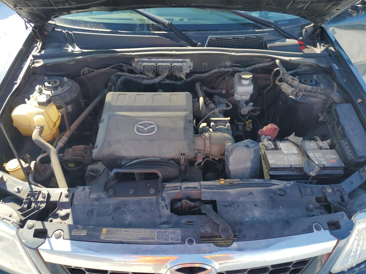 2010 Mazda Tribute VIN 4F2CY9GG1AKM06002 Copart auction photo, side / minor dent/scratches damage thumbnail 12