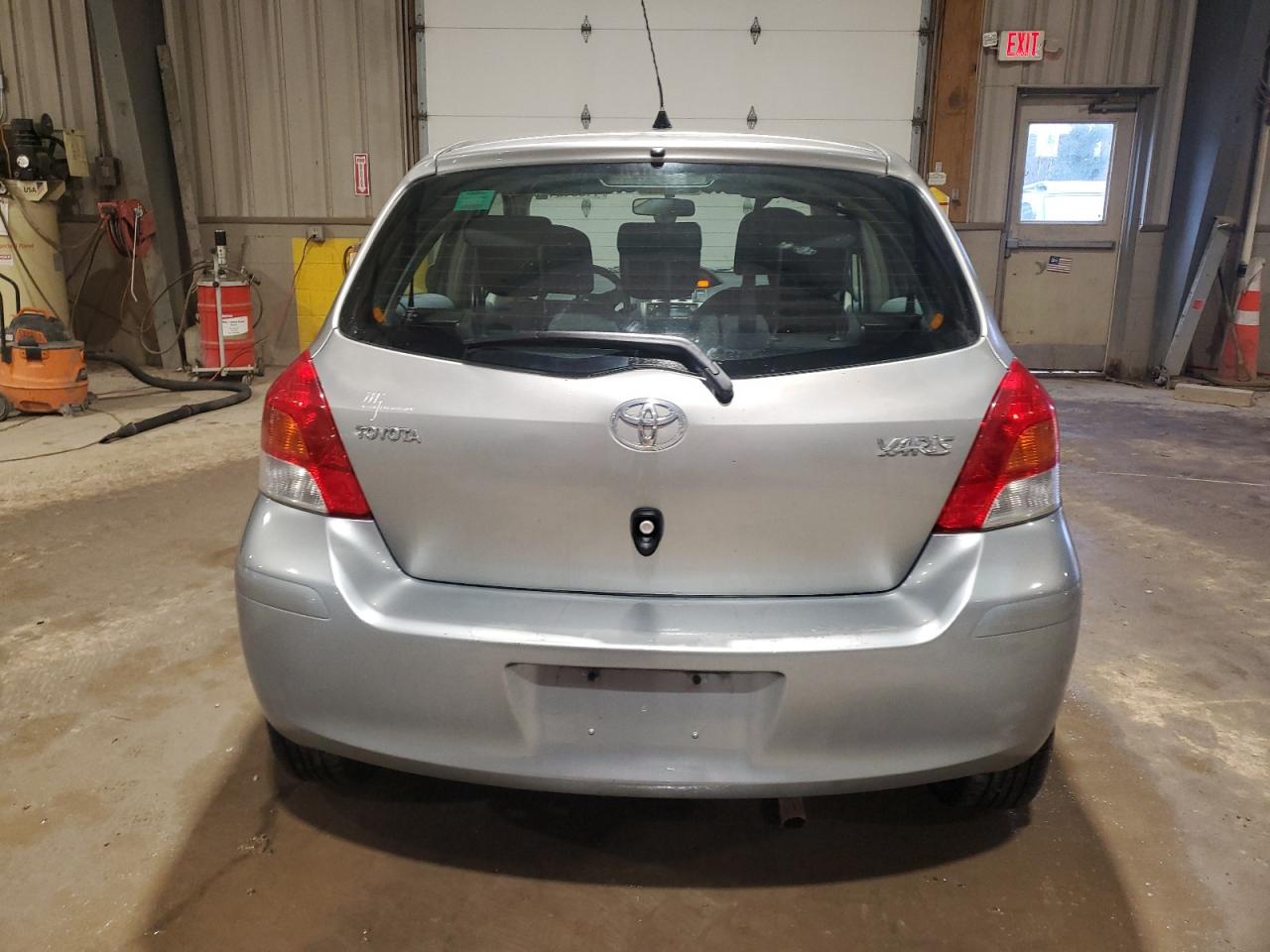 2009 Toyota Yaris VIN JTDKT903895249452 Copart auction photo, minor dent/scratches damage thumbnail 6