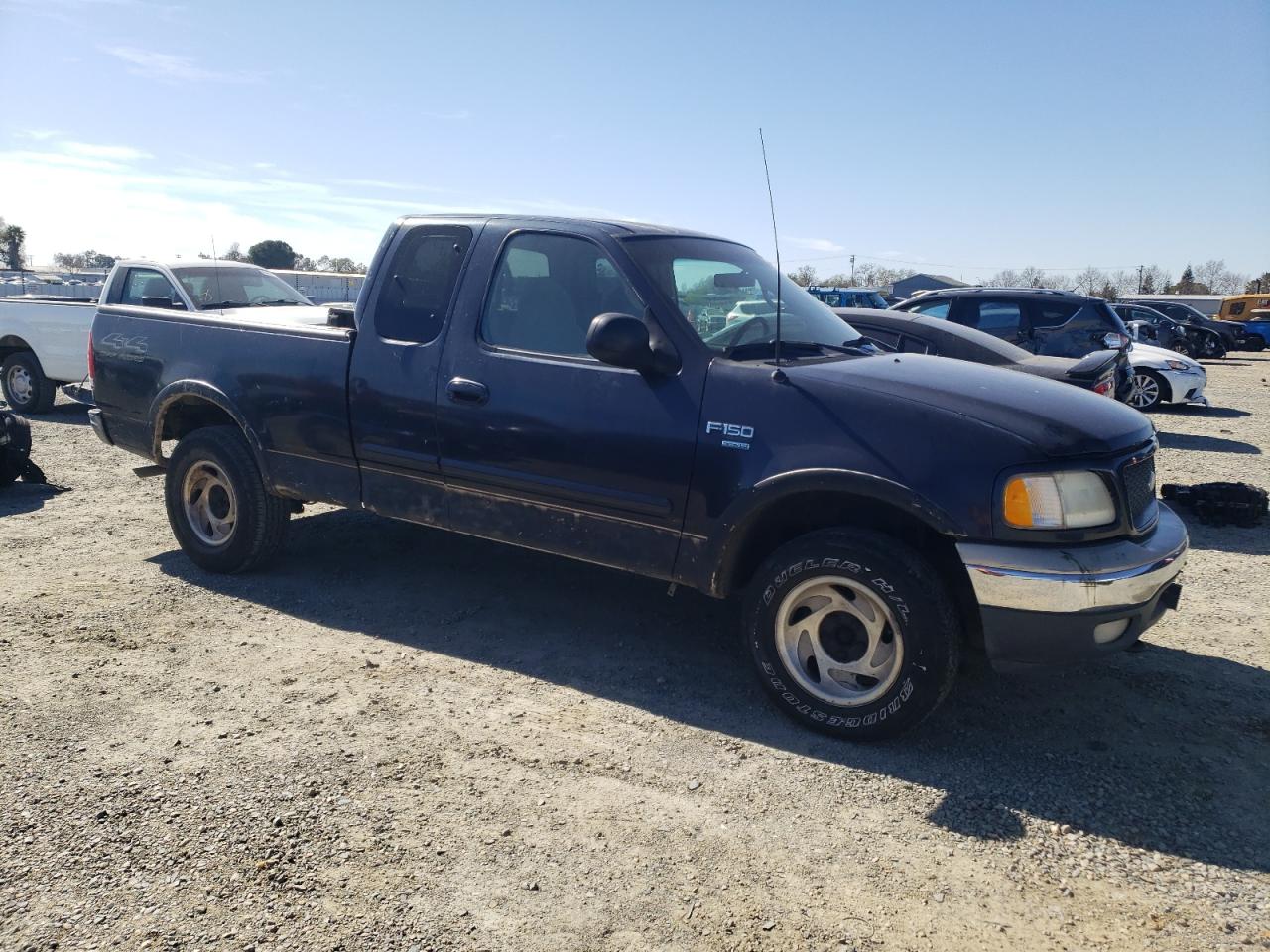 2000 Ford F-150 VIN 1FTRX18W0YKB06899 Copart auction photo, side / rear end damage thumbnail 4