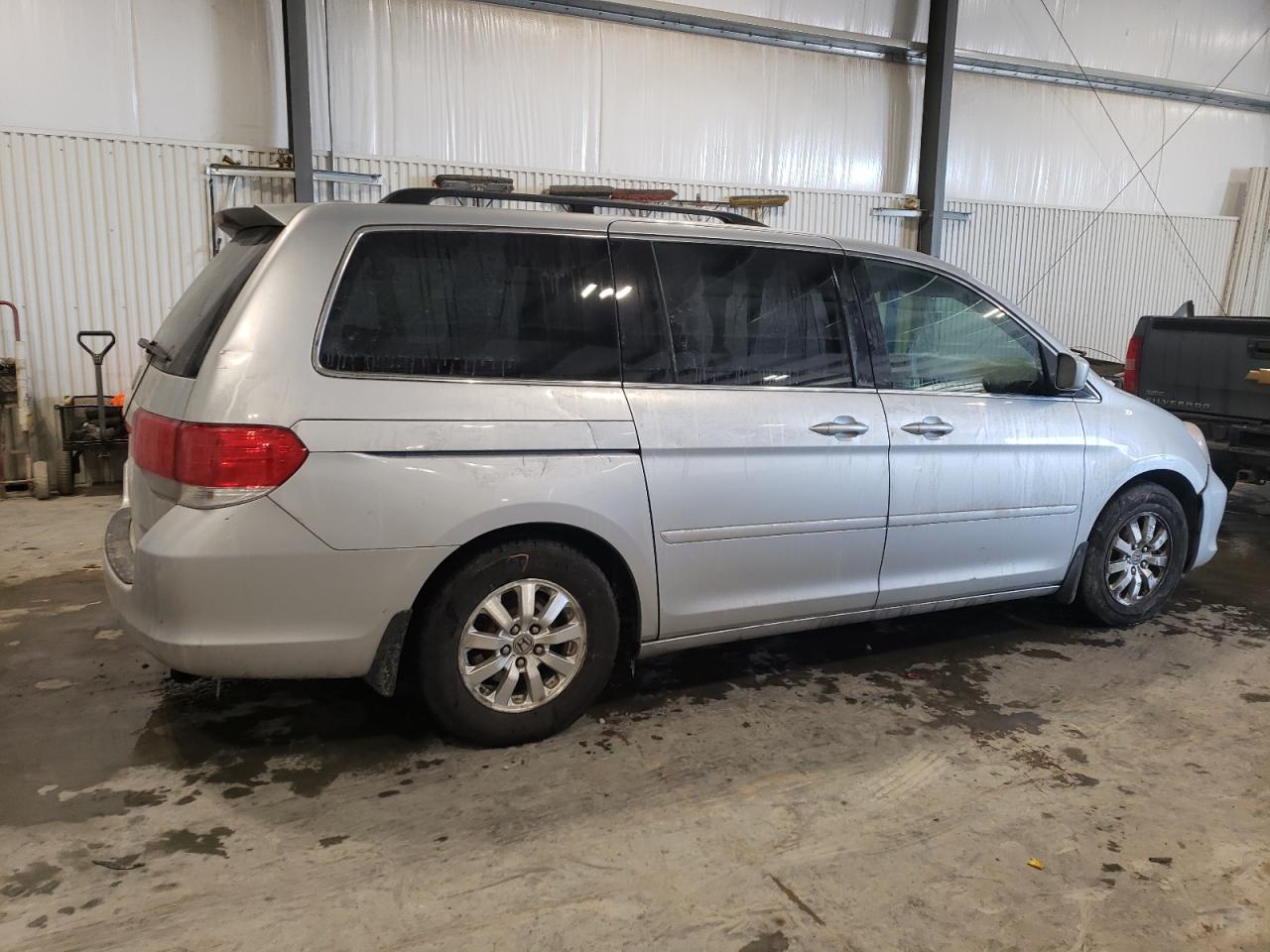 2010 Honda Odyssey VIN 5FNRL3H73AB039203 Copart auction photo, front end / hail damage thumbnail 3