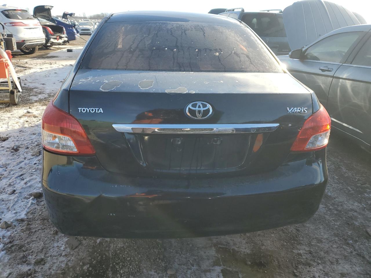 2009 Toyota Yaris VIN JTDBT903394045146 Copart auction photo, all over damage thumbnail 6