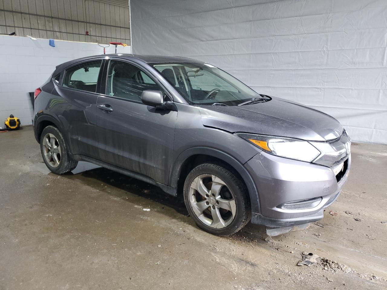2017 Honda HR-V VIN 3CZRU6H37HM712361 Copart auction photo, front end / minor dent/scratches damage thumbnail 4