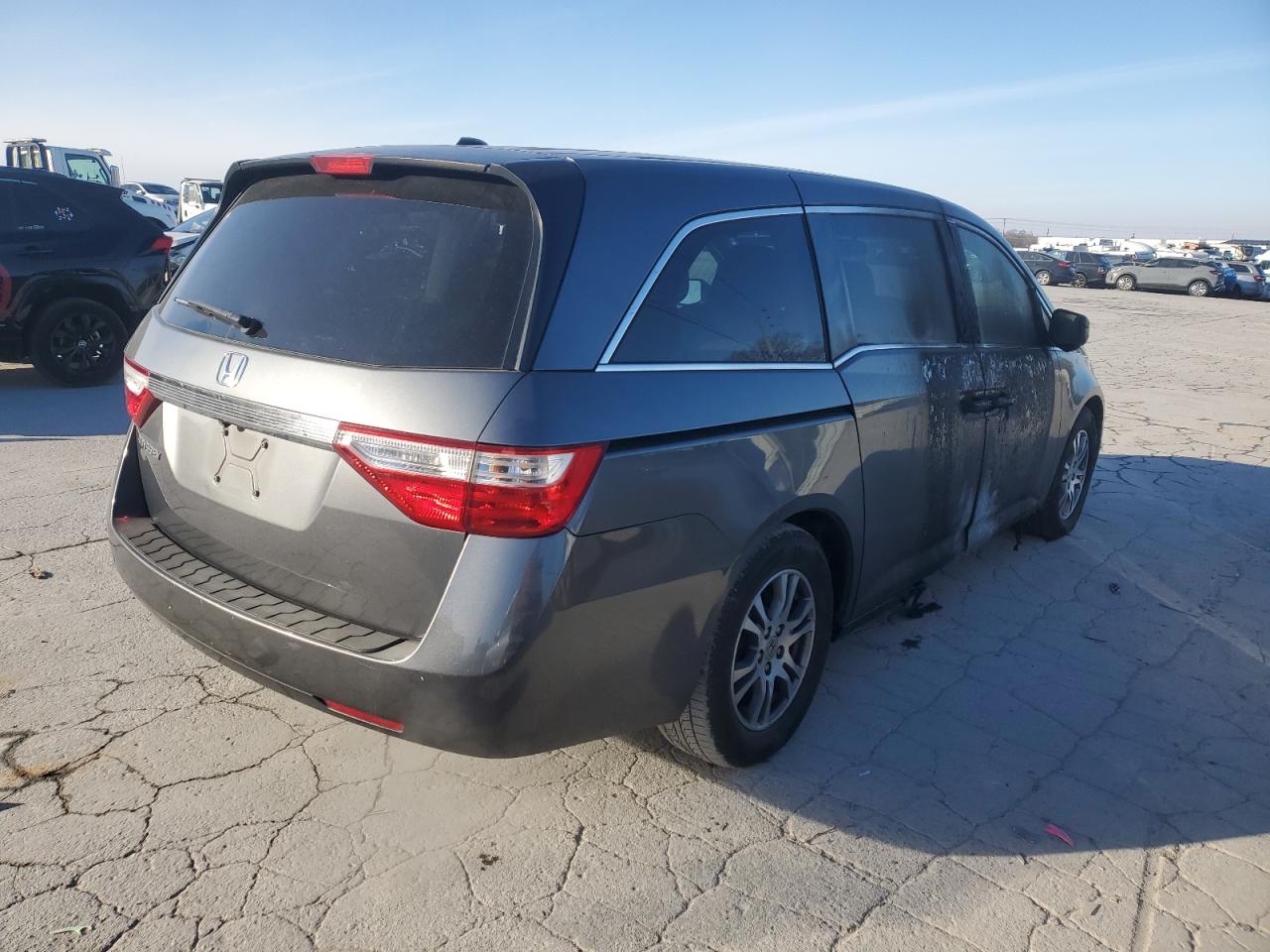 2012 Honda Odyssey VIN 5FNRL5H60CB035065 Copart auction photo, burn damage thumbnail 3