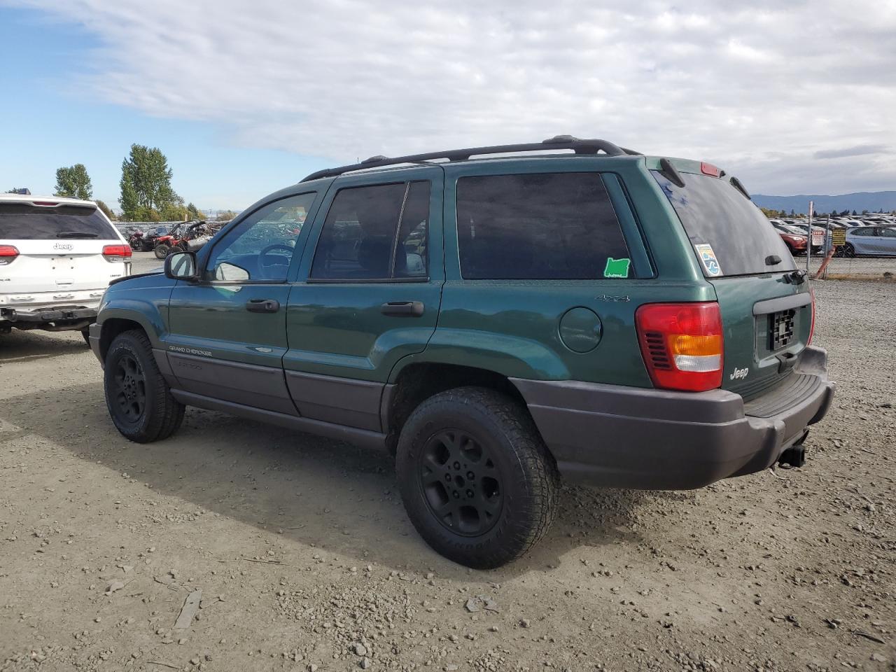 1999 Jeep Grand Cherokee VIN 1J4GW58S0XC700054 Copart auction photo, all over damage thumbnail 2