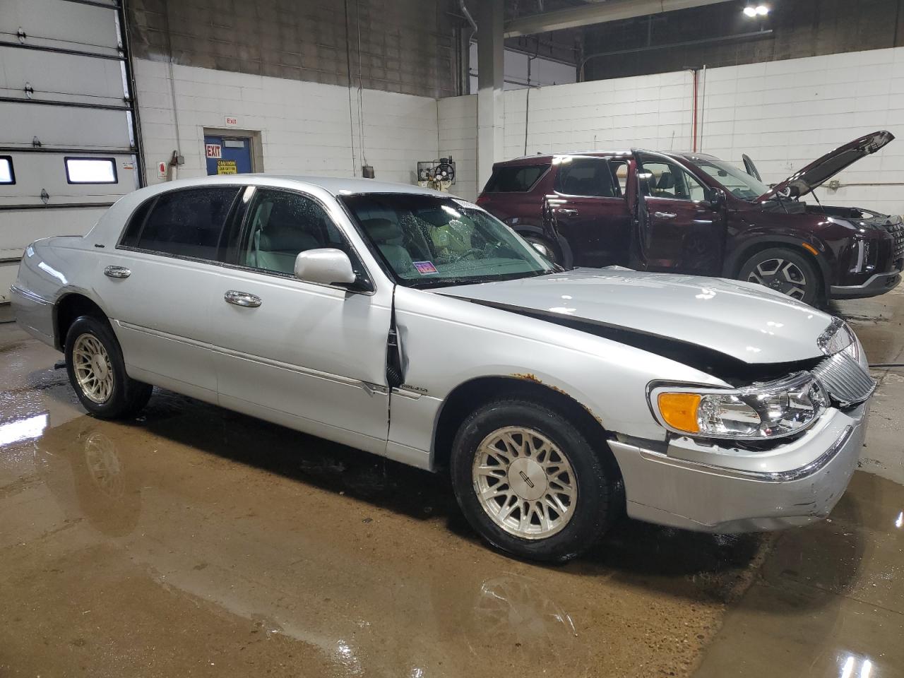 1998 Lincoln Town Car VIN 1LNFM82W8WY666012 Copart auction photo, front end / all over damage thumbnail 4