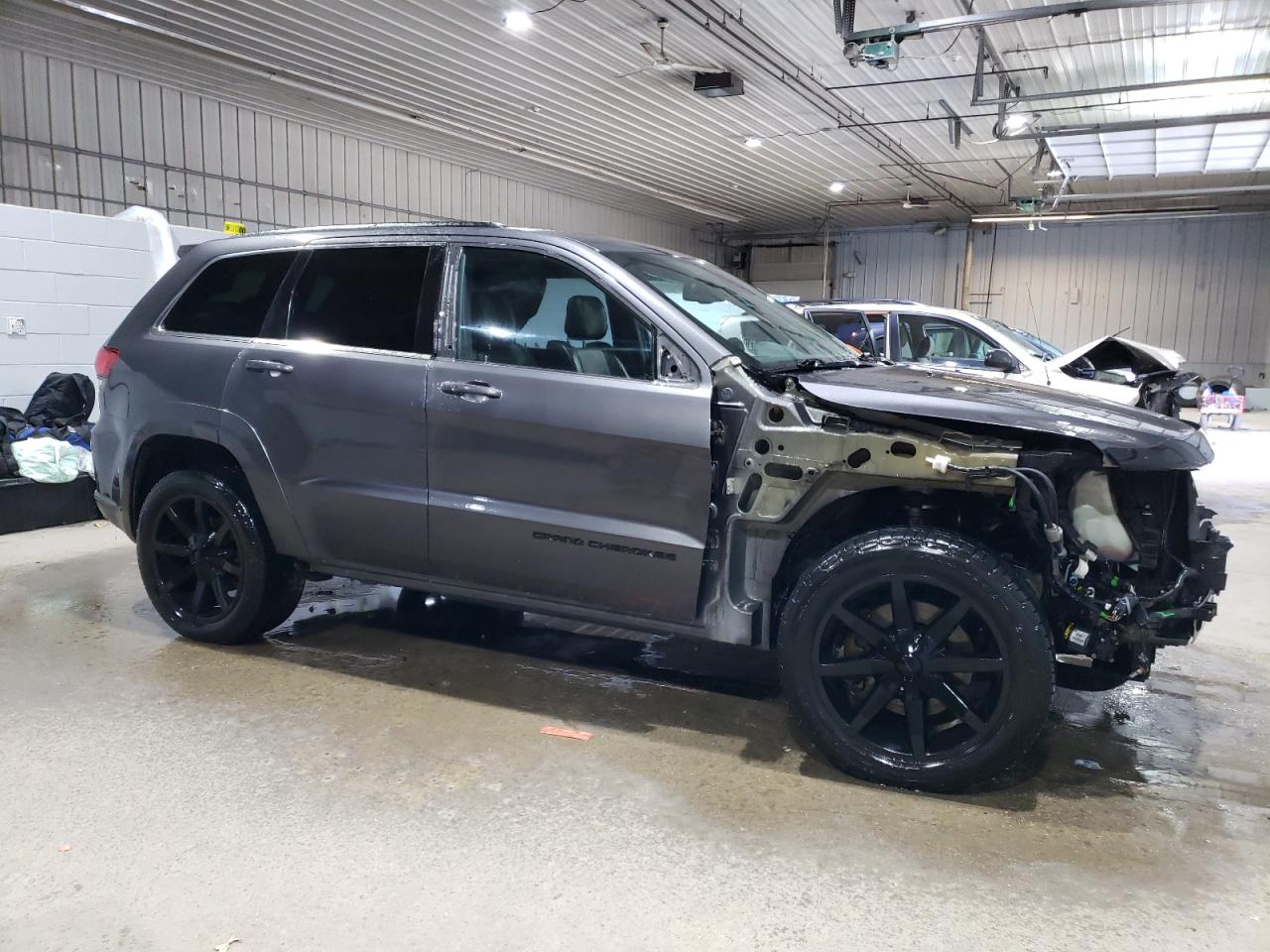 2015 Jeep Grand Cherokee VIN 1C4RJFCT9FC193706 Copart auction photo, front end / undercarriage damage thumbnail 4