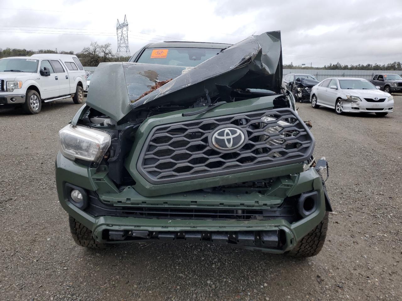 2021 Toyota Tacoma VIN 3TMDZ5BNXMM099474 Copart auction photo, rollover damage thumbnail 5