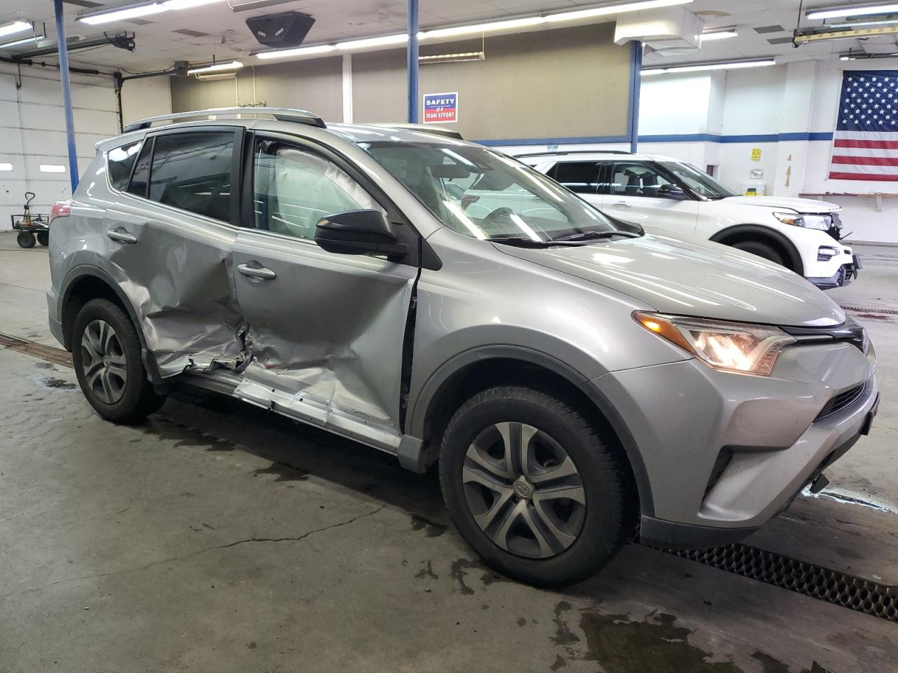 2018 Toyota RAV 4 VIN 2T3BFREV6JW725213 Copart auction photo, side damage thumbnail 4