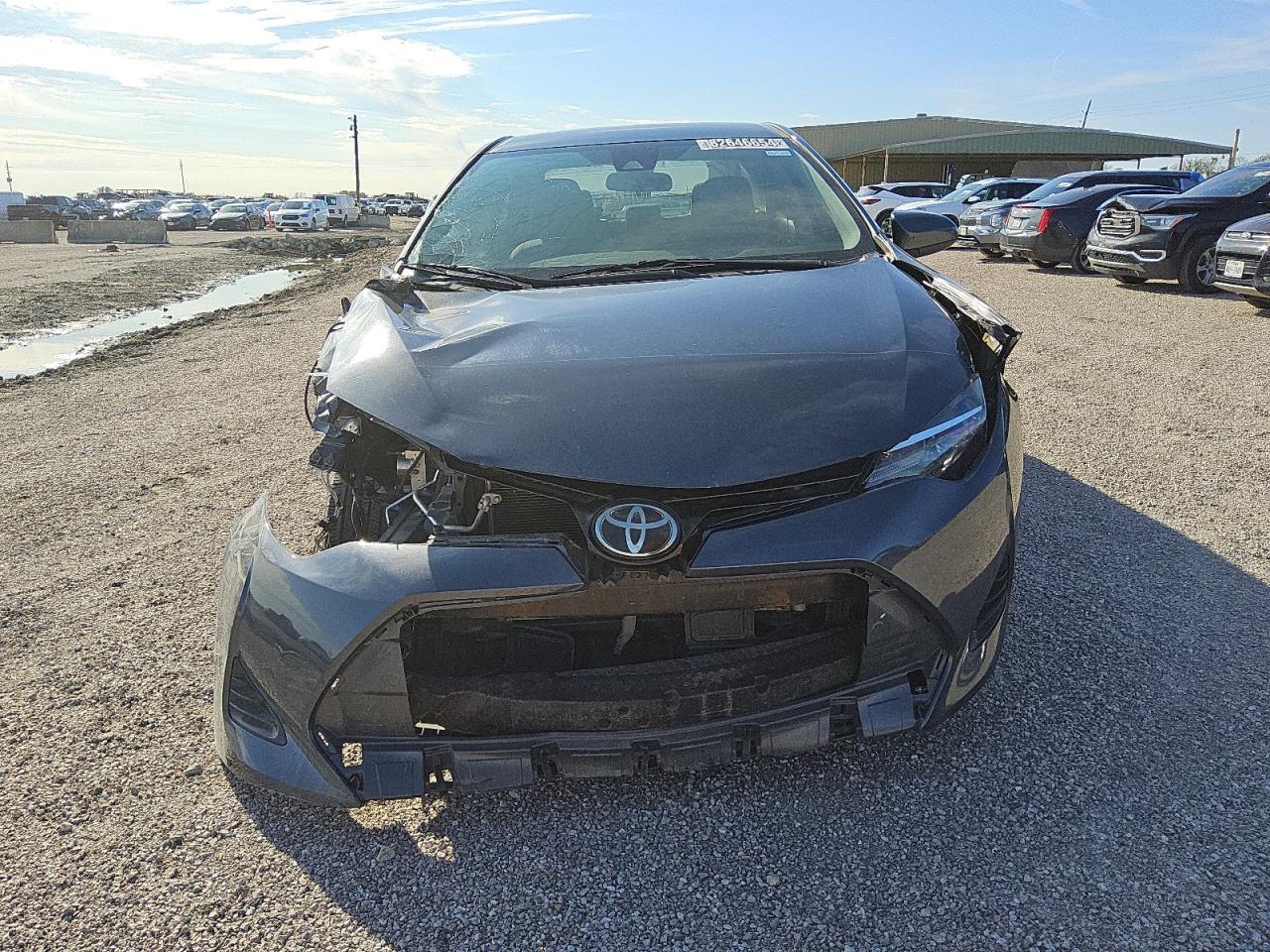 2019 Toyota Corolla VIN 5YFBURHE0KP911441 Copart auction photo, side / front end damage thumbnail 5